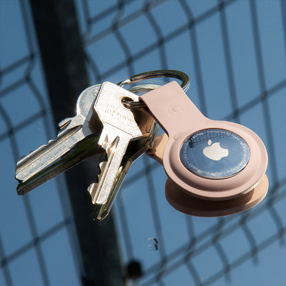 Crong silikoninis dėklas su raktų pakabuku – apsauginis dėklas Apple AirTag raktų pakabukui (smėlio rožinės spalvos)